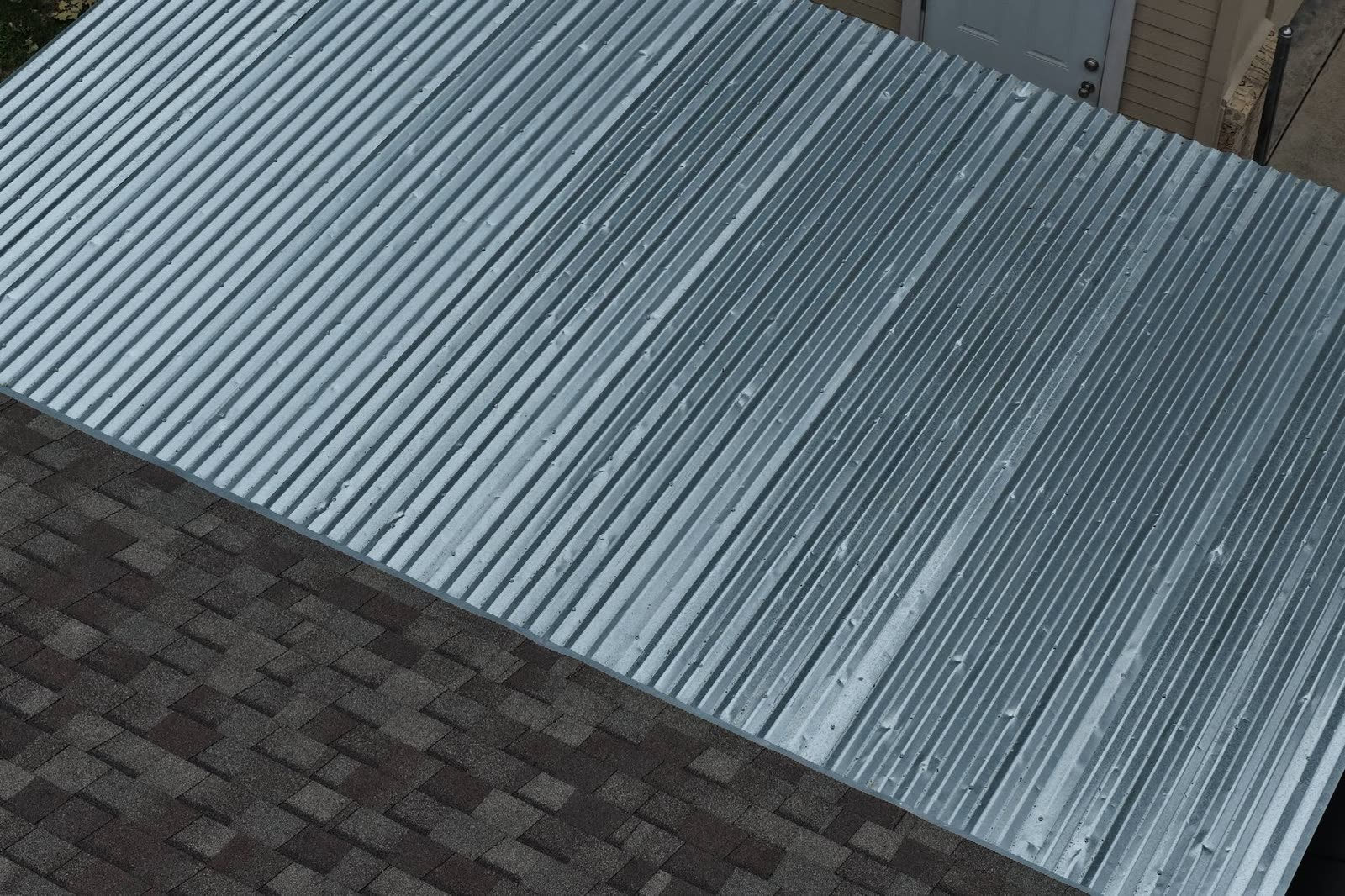 Aerial view of a hail-damaged metal roof
